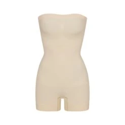 SEAMLESS SCULPT STRAPLESS SHORTIE BODYSUIT | SAND