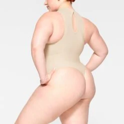 SEAMLESS SCULPT HIGH NECK THONG BODYSUIT | SAND 7 SEAMLESS SCULPT HIGH NECK THONG BODYSUIT | SAND -SWIM Sales Store SKIMS SHAPEWEAR BD THG 2905 JB SND 0007 SD