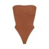 SEAMLESS SCULPT STRAPLESS THONG BODYSUIT | BRONZE