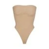 SEAMLESS SCULPT STRAPLESS THONG BODYSUIT | CLAY