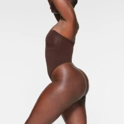 SEAMLESS SCULPT STRAPLESS THONG BODYSUIT | ESPRESSO 8 SEAMLESS SCULPT STRAPLESS THONG BODYSUIT | ESPRESSO -SWIM Sales Store SKIMS SHAPEWEAR BD THG 2913 IC ESP 0031 SD