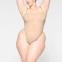 SEAMLESS SCULPT STRAPLESS THONG BODYSUIT | MICA -SWIM Sales Store SKIMS SHAPEWEAR BD THG 2913 JB MCA 0005 FR 92d79b57 424d 44df 8b33 5ad9368fda13