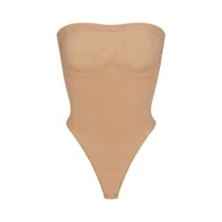 SEAMLESS SCULPT STRAPLESS THONG BODYSUIT | OCHRE