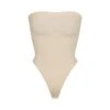 SEAMLESS SCULPT STRAPLESS THONG BODYSUIT | SAND