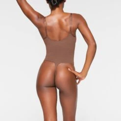 SEAMLESS SCULPT THONG BODYSUIT | JASPER 8 SEAMLESS SCULPT THONG BODYSUIT | JASPER -SWIM Sales Store SKIMS SHAPEWEAR BD THG 3369 IB JSP 0022 BK