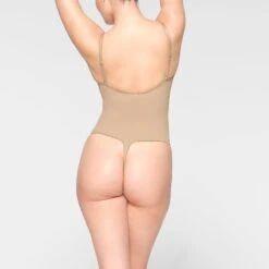 SEAMLESS SCULPT THONG BODYSUIT | CLAY 8 SEAMLESS SCULPT THONG BODYSUIT | CLAY -SWIM Sales Store SKIMS SHAPEWEAR BD THG 3369 IE CLY 0018 BK