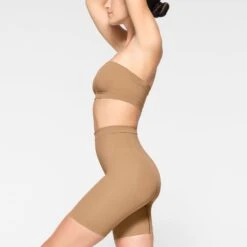 SEAMLESS SCULPT BANDEAU | OCHRE -SWIM Sales Store SKIMS SHAPEWEAR BR BAN 2895 JC OCH 0044 SD