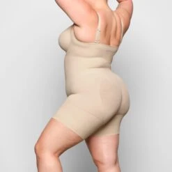 BUTT ENHANCING OPEN BUST BODYSUIT | SAND -SWIM Sales Store SKIMS SHAPEWEAR SH BDY 2168 ZB SND 0011