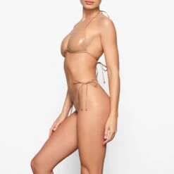 PVC TIE BIKINI BOTTOM | OCHRE 7 PVC TIE BIKINI BOTTOM | OCHRE -SWIM Sales Store SKIMS SWIM BB BRF 3193 ED OCH 0010