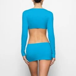 SWIM LONG SLEEVE SHRUG | TURQUOISE 8 SWIM LONG SLEEVE SHRUG | TURQUOISE -SWIM Sales Store SKIMS SWIM SW LGS 0015 CD TRQ 0018 BK