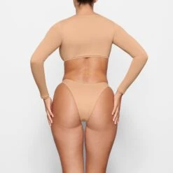 SWIM LONG SLEEVE SHRUG | OCHRE 8 SWIM LONG SLEEVE SHRUG | OCHRE -SWIM Sales Store SKIMS SWIM SW LGS 0015 MM OCH BK