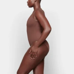 SWIM ZIP FRONT SLEEVELESS ONE PIECE | COCOA -SWIM Sales Store SKIMS SWIM SW SLO 0149 TA COA 0008 SD 6a6108d8 a519 4401 a7ad 147218dc8a07 scaled