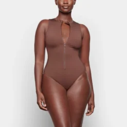 SWIM ZIP FRONT SLEEVELESS ONE PIECE | COCOA -SWIM Sales Store SKIMS SWIM SW SLO 0149 TA COA 0019 FR f8242b91 6dd1 4282 b315 e4655e6f601b scaled