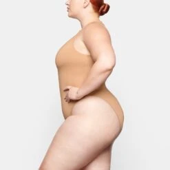 SWIM ZIP FRONT SLEEVELESS ONE PIECE | OCHRE -SWIM Sales Store SKIMS SWIM SW SLO 0149 TB OCH 0009 SD