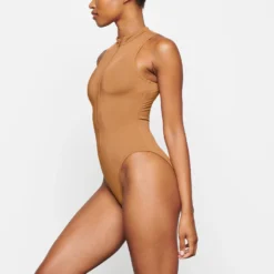 SWIM ZIP FRONT SLEEVELESS ONE PIECE | ALMOND -SWIM Sales Store SKIMS SWIM SW SLO 0149 TD ALM 0011 SD
