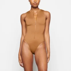 SWIM ZIP FRONT SLEEVELESS ONE PIECE | ALMOND -SWIM Sales Store SKIMS SWIM SW SLO 0149 TD ALM 0024 FR
